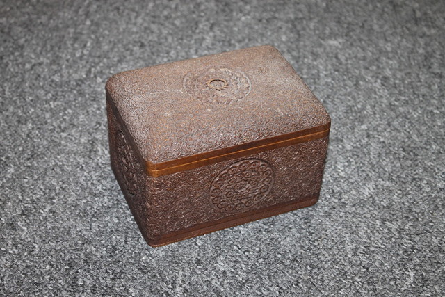 Appraisal: A CARVED BURMESE FOLDING HARDWOOD CIGARETTE BOX with allover leaf