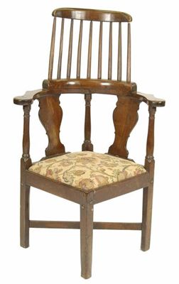 Appraisal: An th century laburnum corner armchair the raised spindle back