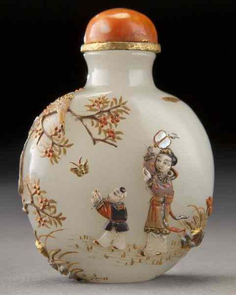 Appraisal: Chinese Qing carved white jade snuff bottlewith applied gilt and