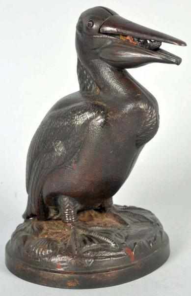 Appraisal: Cast Iron Pelican Mechanical Bank Man thumbs nose variation Condition