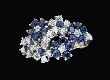 Appraisal: Platinum sapphire and diamond flower ring Clustered flower form set