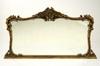 Appraisal: MIRROR - Circa gilded overmantel mirror with ornate gesso leaf