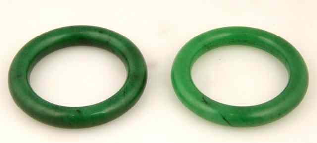 Appraisal: A near pair of dark green jade bangles cm diameter