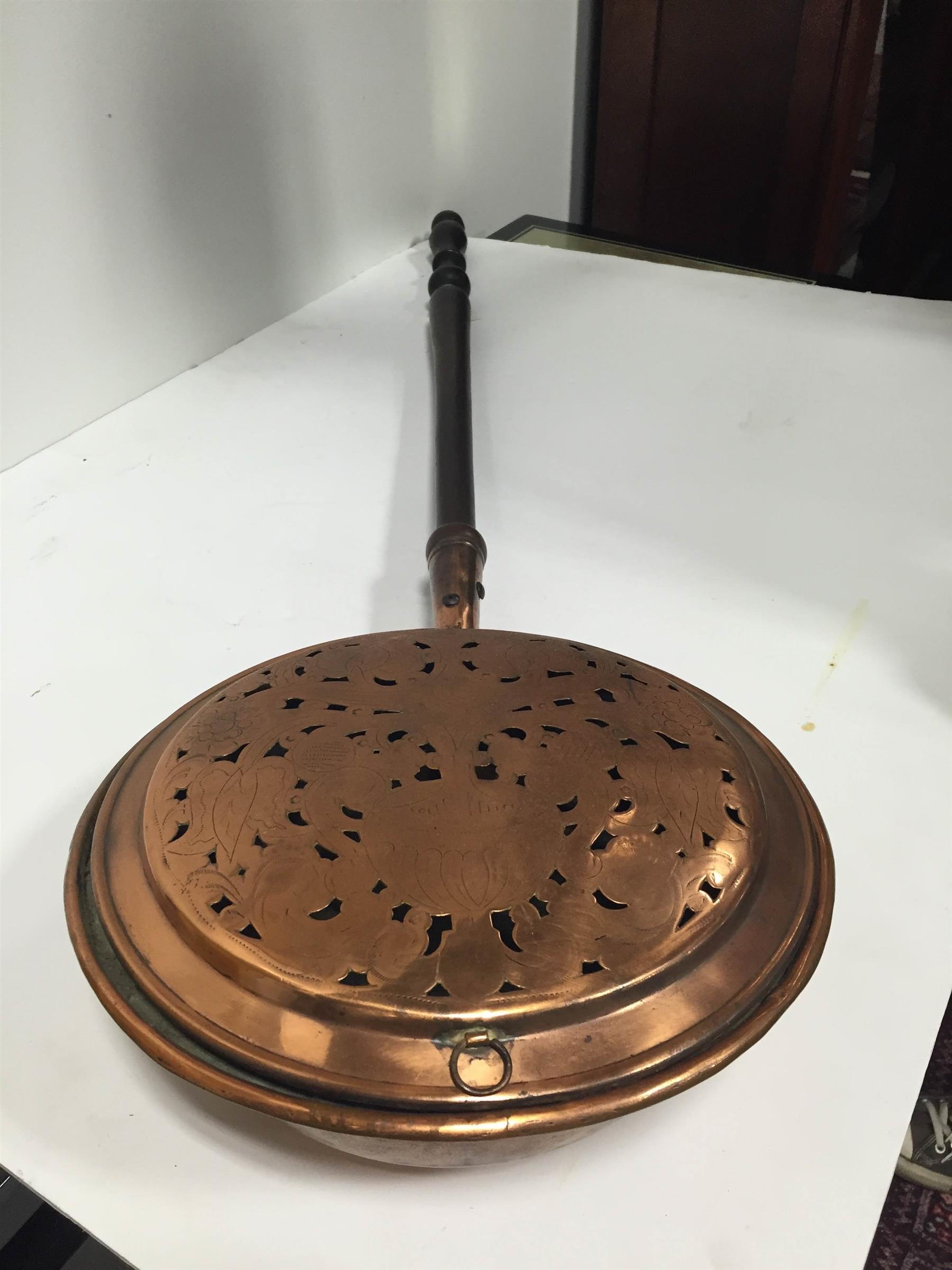 Appraisal: COPPER BED WARMER American mid- th century Punched copper in