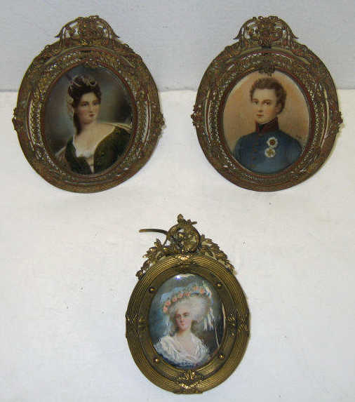 Appraisal: THREE HAND PAINTED PORTRAIT MINIATURES A pair of portraits painted