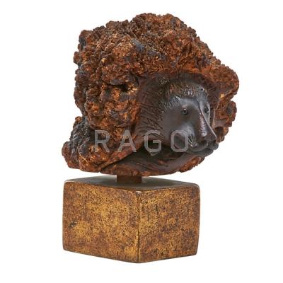 Appraisal: BURLWOOD CARVING Animal head with glass eyes on wood base