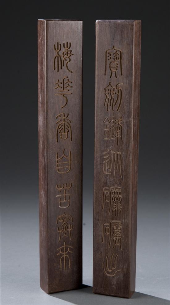 Appraisal: Pair of Chinese wood carved paper weights Both having incised