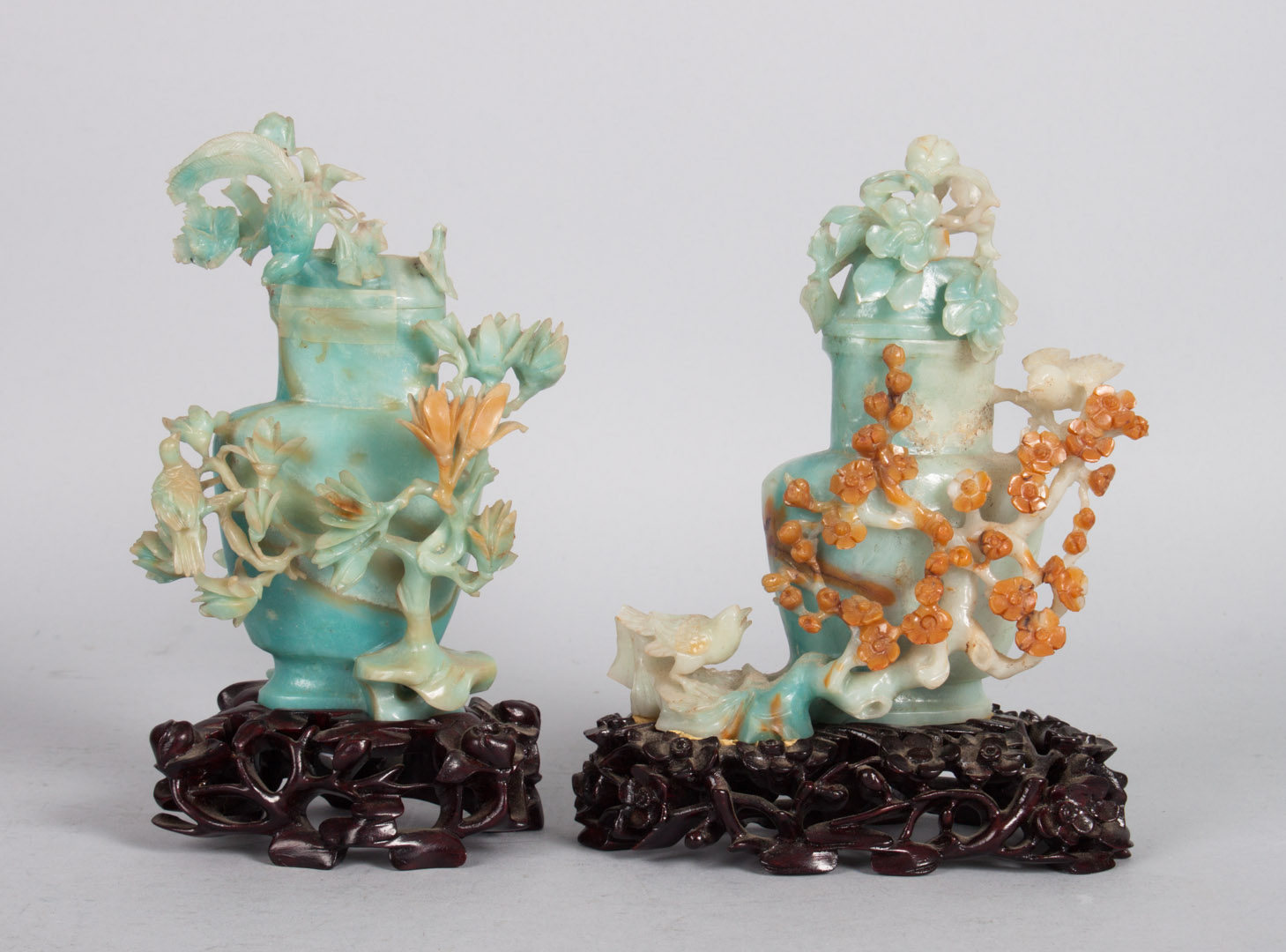 Appraisal: Two Chinese carved blue and green jade urns each on