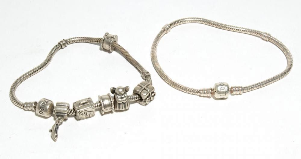 Appraisal: Pandora Silver Charm Bracelets Two sterling silver Pandora charm bracelets