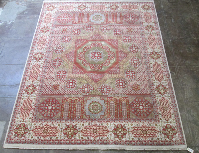 Appraisal: HAND KNOTTED ORIENTAL CARPET Indo-Persian geometric medallion and floral panel