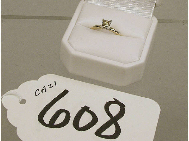 Appraisal: K yellow gold lady's ring set with a princess cut