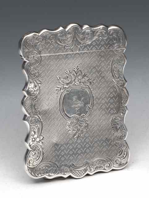 Appraisal: A VICTORIAN SILVER CARD CASE with shaped sides engraved with