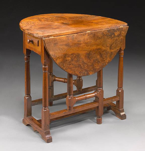 Appraisal: A Charles II style yew wood and fruitwood gateleg table