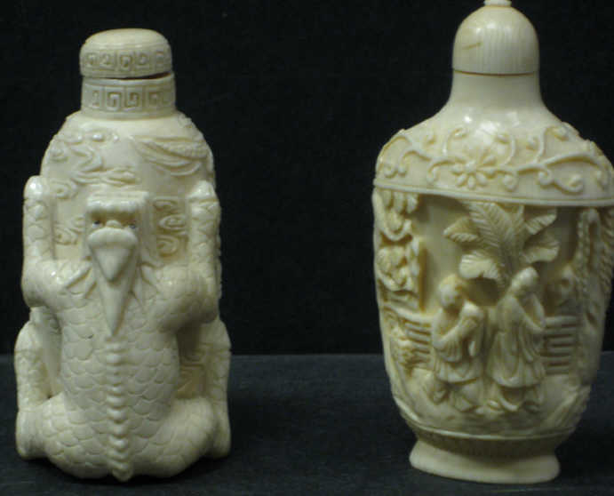 Appraisal: TWO CHINESE IVORY SNUFF BOTTLES Traditional forms one carved with