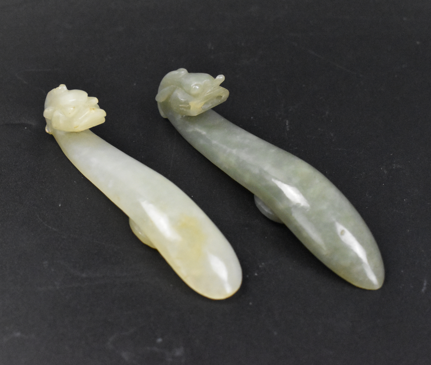 Appraisal: Two Chinese jade carved belt hooks dating from the Qing