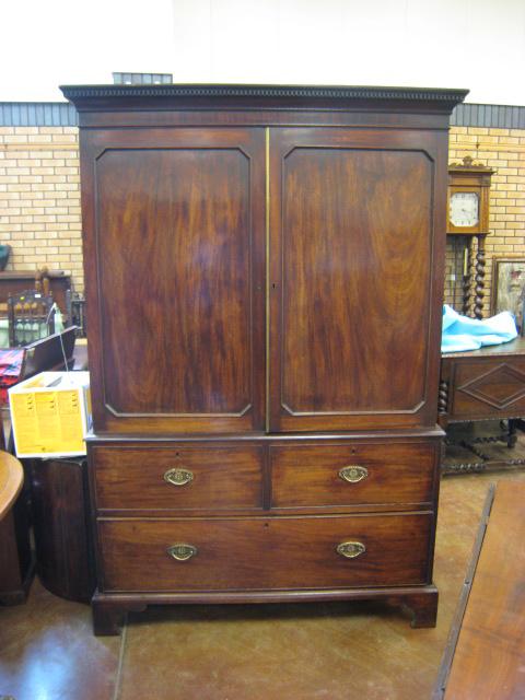 Appraisal: A th Century mahogany Linen Press with dentil cornice above