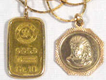 Appraisal: Two gold pendants on gold plated chains one marked ARGOR