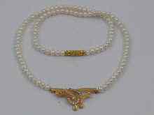 Appraisal: A cultured pearl necklace with a yellow metal tests ct