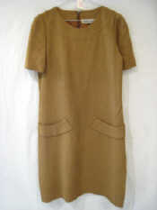 Appraisal: A brown Carolina Herrara dress with pocket detail on the