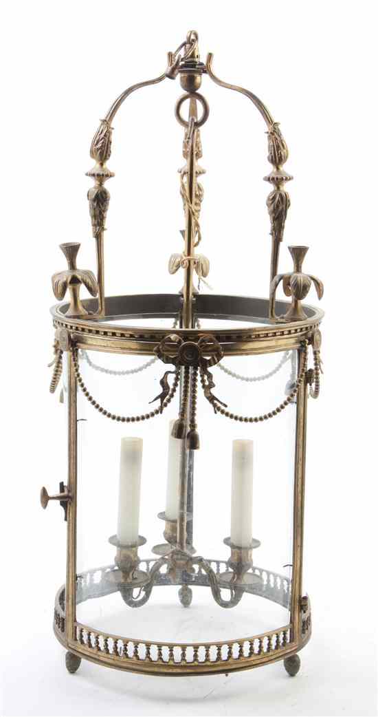 Appraisal: A Neoclassical Gilt Bronze Lantern having a tripartite standard issuing