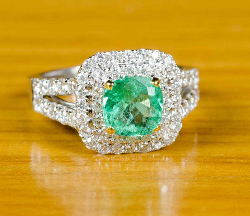 Appraisal: EMERALD DIAMOND AND EIGHTEEN KARAT GOLD RING The white gold