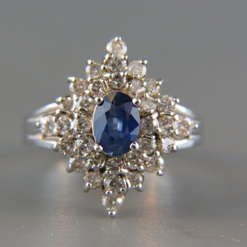 Appraisal: Sapphire Diamond Ring oval rich blue gem weighing carat surrounded