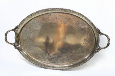 Appraisal: An oval silver tray Elkington Co Birmingham with scroll handles