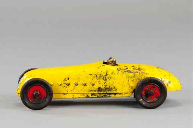 Appraisal: KINGSBURY LITTLE JIM RACER Pressed steel painted in yellow scarce