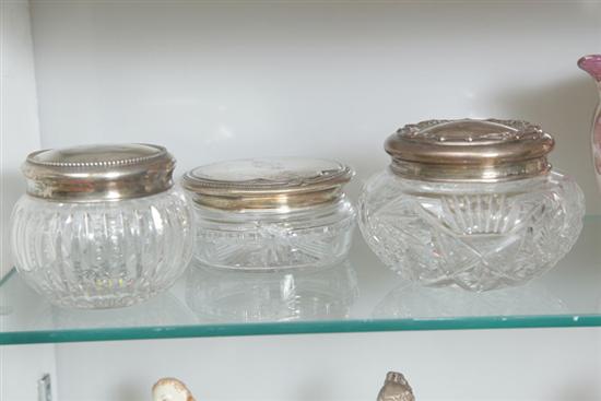 Appraisal: THREE GLASS DRESSER JARS WITH STERLING SILVER LIDS Having engraved