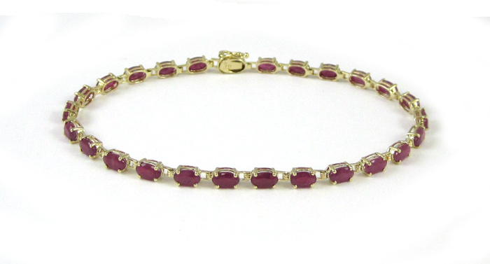 Appraisal: RUBY AND FOURTEEN KARAT GOLD BRACELET measuring - inches in