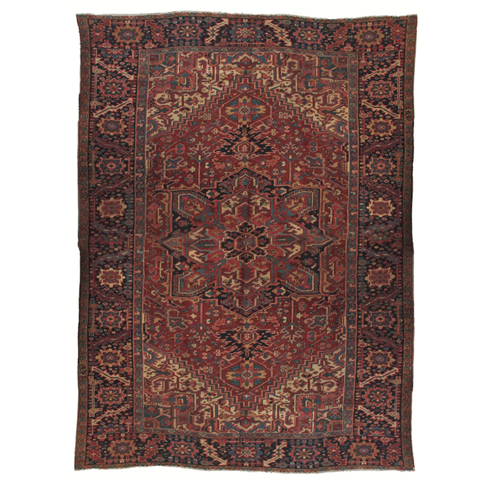 Appraisal: Persian Heriz rug c floral design in red blue and