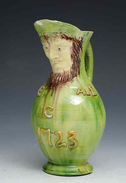 Appraisal: A Castle Hedingham mask jug made by Edward Bingham with