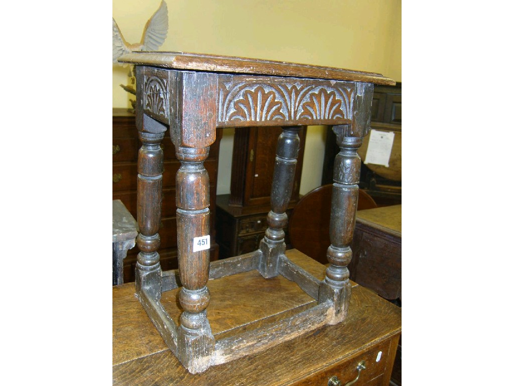 Appraisal: An th century oak joint stool with carved frieze raised