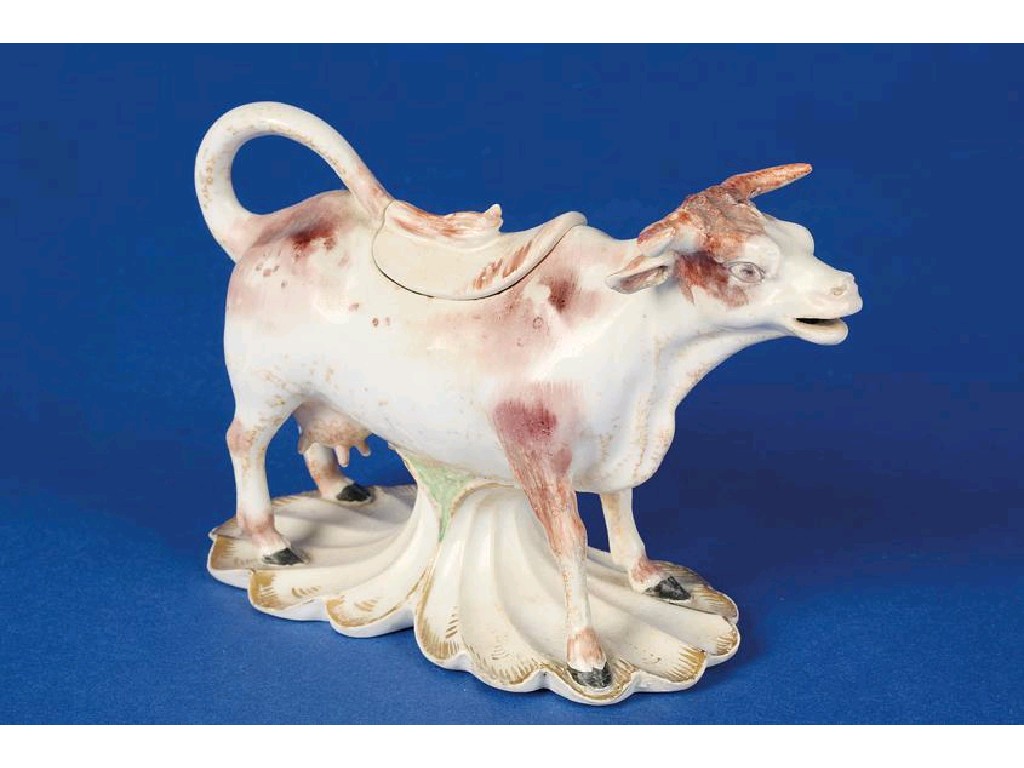 Appraisal: A TH CENTURY STAFFORDSHIRE PORCELAIN COW CREAMER AND COVER the