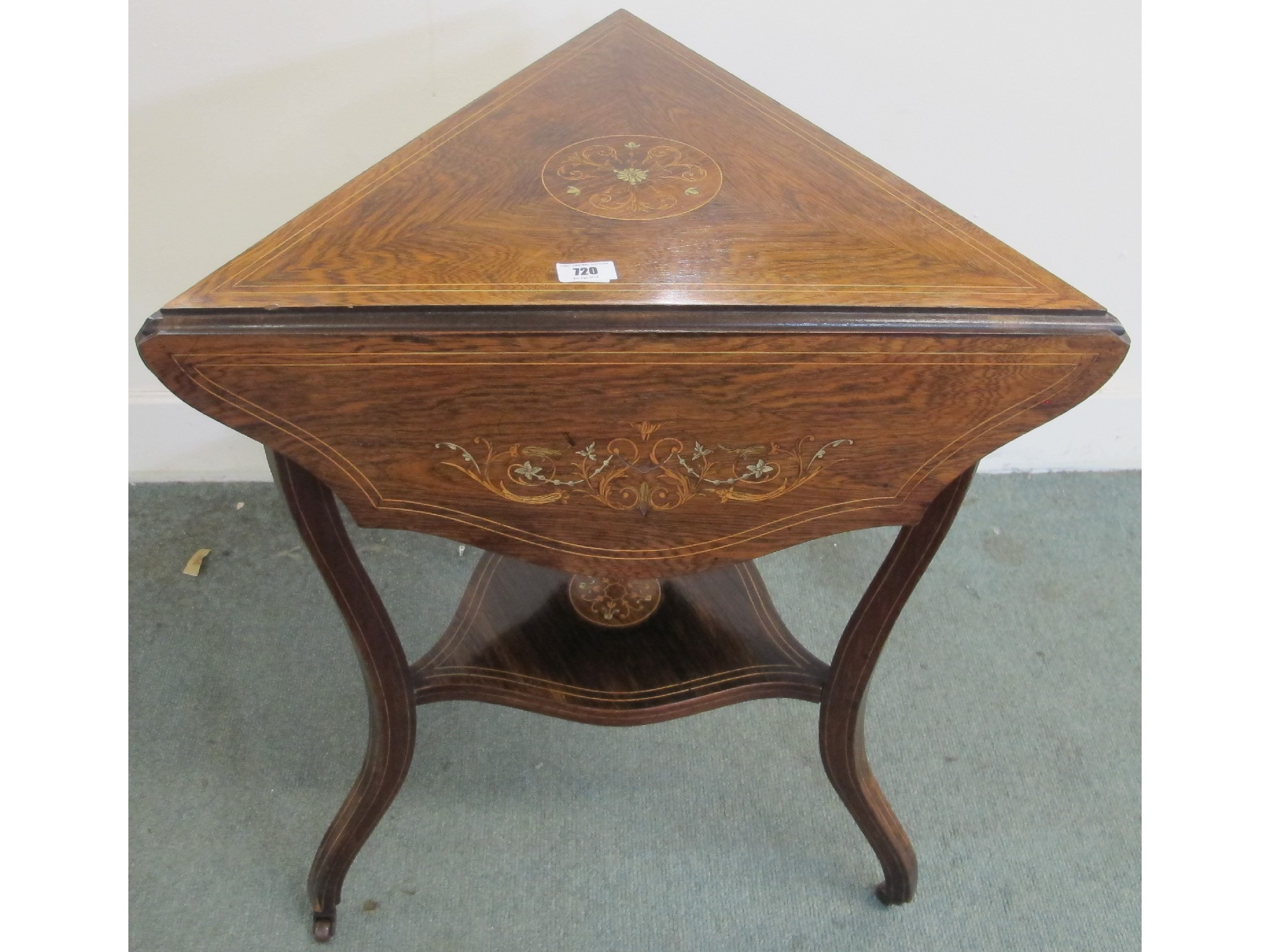 Appraisal: A Victorian rosewood triangular folding inlaid occasional table