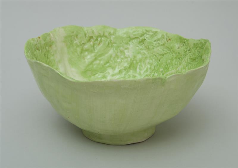 Appraisal: DODIE THAYER GREEN GLAZED POTTERY LETTUCE LEAF BOWL Inscribed 'Dodie