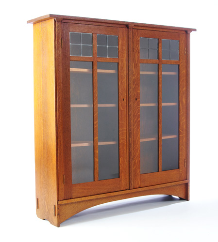 Appraisal: GUSTAV STICKLEY Harvey Ellis-designed two-door bookcase with leaded panes Refinished