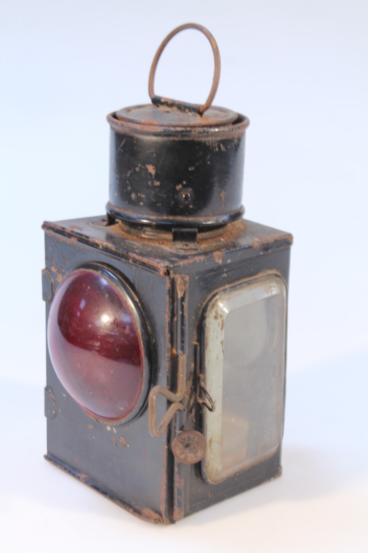 Appraisal: An early thC cast metal railway lantern in black centred