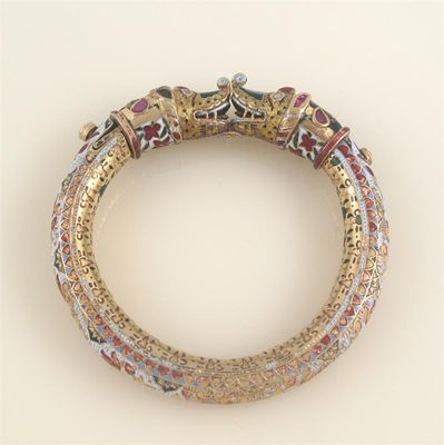 Appraisal: A th century Indian gold bangle mounted with red stones