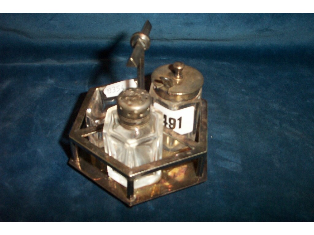 Appraisal: A silver plated condiment set of hexagonal form with shaped