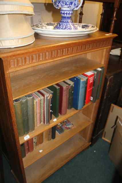 Appraisal: AN OAK OPEN BOOKCASE with fluted frieze fitted adjustable shelves