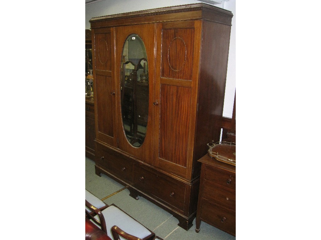 Appraisal: Edwardian mahogany mirror door triple wardrobe with dressing table chest