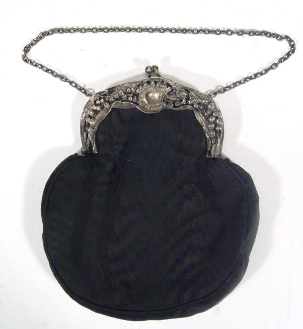 Appraisal: Edwardian silver metal clasped black clutch bag the clasp moulded