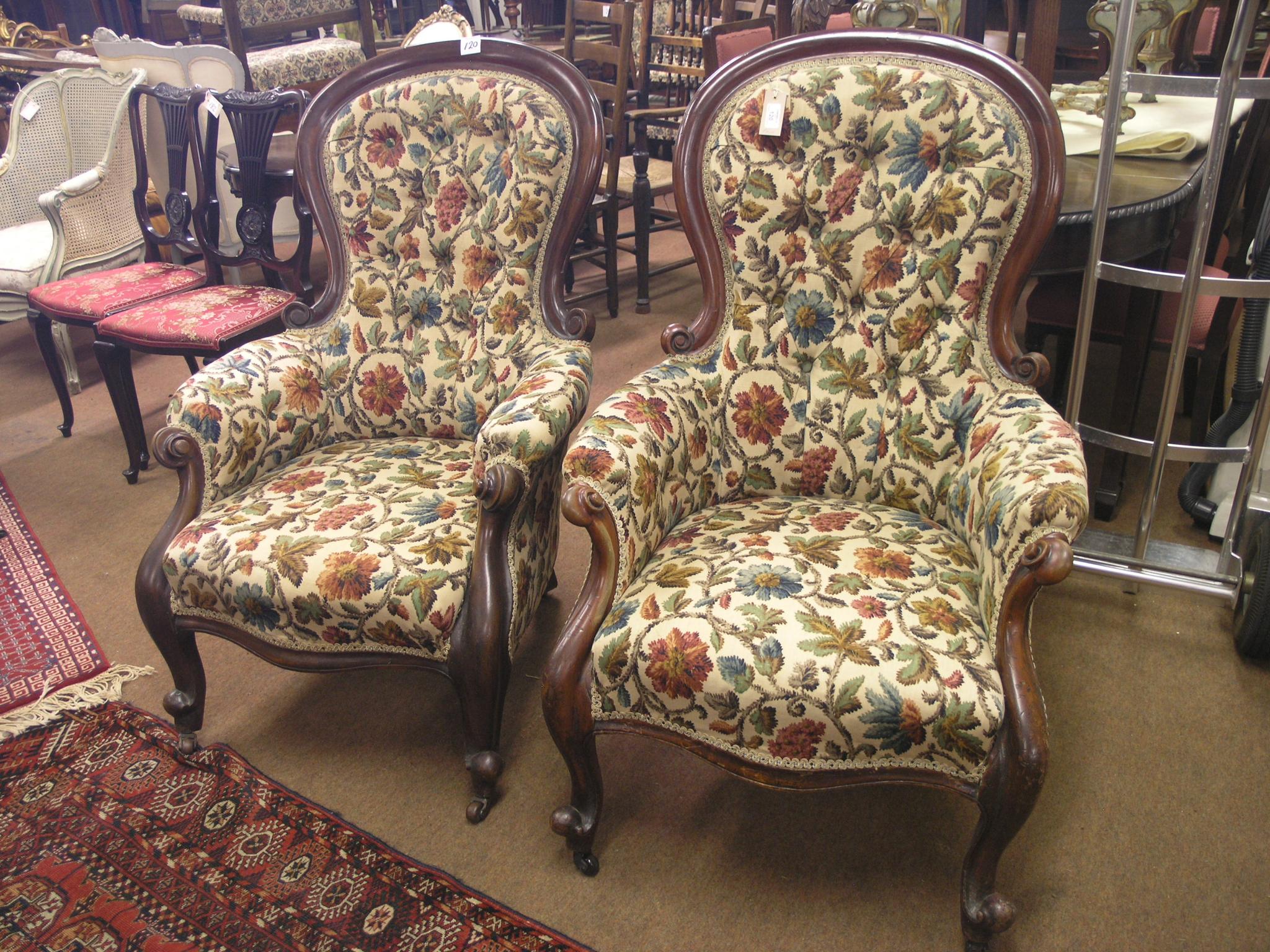 Appraisal: A near-pair of Victorian mahogany spoon-back drawing room armchairs scroll