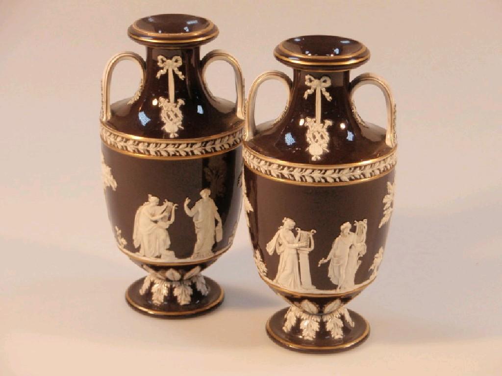 Appraisal: A pair of Wedgwod glazed pottery two handled vases brown