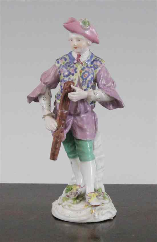 Appraisal: A Meissen figure of a musician dot period standing holding