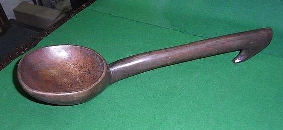 Appraisal: A TRIBAL CARVED LADLE SPOON carved from one piece of