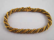 Appraisal: A yellow and white metal tests carat gold rope bracelet