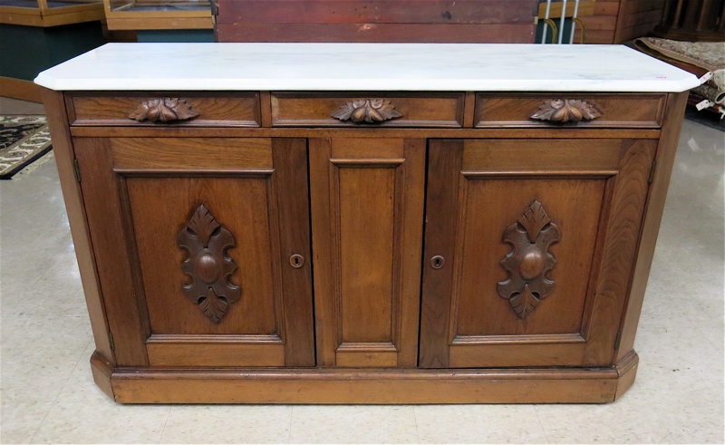 Appraisal: A VICTORIAN MARBLE TOP WALNUT BUFFET American last quarter of