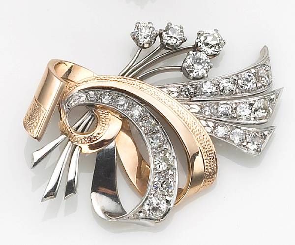 Appraisal: A diamond and eighteen karat bicolor gold brooch the spray